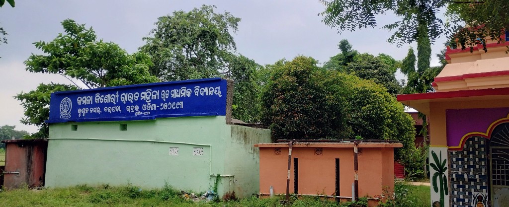 School entrance sign with campus temple in the background