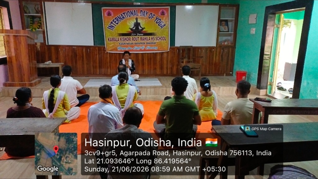 International Day of Yoga session led by an instructor at Kamala Kishori Rout Mahila HS School